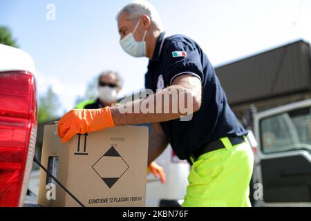 A Factory in Correggio donates alcohol bottles to be distributed by Red Cross and Civil Protection during COVID-19 pandemic in Italy on May 2, 2020 in Correggio, Italy. (Photo by Emmanuele Ciancaglini/NurPhoto) Stock Photo