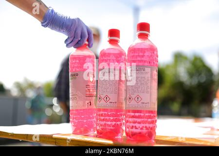 A Factory in Correggio donates alcohol bottles to be distributed by Red Cross and Civil Protection during COVID-19 pandemic in Italy on May 2, 2020 in Correggio, Italy. (Photo by Emmanuele Ciancaglini/NurPhoto) Stock Photo