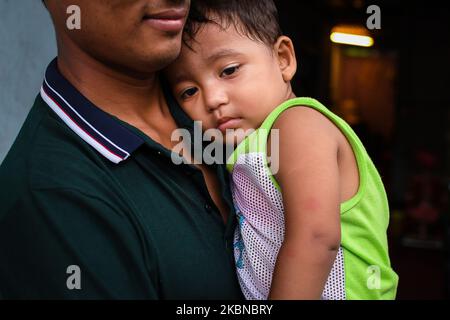 Mohd Ariffin Mohd Amin,(1) with his father Mohd Amin Abdul Salah,27 during the holy month of Ramadan and Conditional Movement Control Order(CMCO) in Kuala Lumpur, Malaysia on May 5, 2020. (Photo by Afif Abd Halim/NurPhoto) Stock Photo