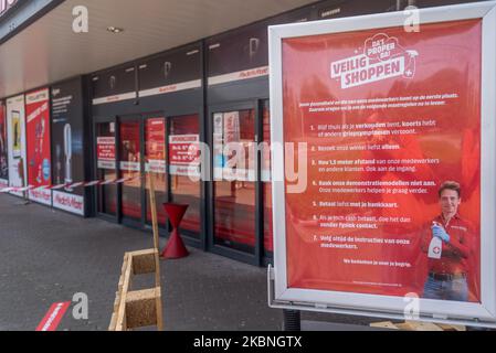 The entrance of Media markt with stickers to help people keep their  distance in Oostakker, Belgium on May 9, 2020. Belgium will start phase two  with the opening of shops allowing more