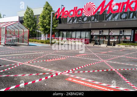 The entrance of Media markt with stickers to help people keep their  distance in Oostakker, Belgium on May 9, 2020. Belgium will start phase two  with the opening of shops allowing more