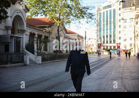 A man walks on empty Istiklal Street during the curfew in Istanbul, Turkey on May 09, 2020. Turkey has reimposed a 48-hour curfew in 24 provinces beginning at midnight as part of measures to stem the spread of the novel coronavirus, the country’s Interior Ministry announced. (Photo by Cem Tekke?ino?lu/NurPhoto) Stock Photo