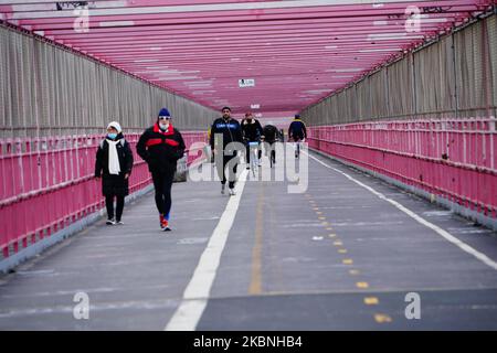 A view of people walking at the Williamsburg Bridge in New York City USA during the coronavirus pandemic on May 9, 2020 in New York City. COVID-19 has spread to most countries around the world, claiming over 270,000 lives with over 3.9 million infections reported. (Photo by John Nacion/NurPhoto) Stock Photo