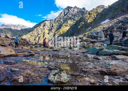 July 14th 2022, Himachal Pradesh India. Devotees offering their prayers at the Nain Sarovar lake during Shrikhand Mahadev Kailash Yatra in the Himalay Stock Photo