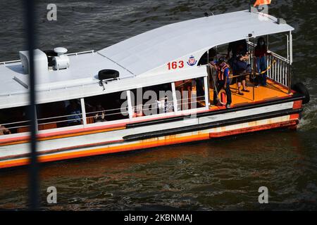 A Chao Phraya Express Boat which carrying passengers from Nonthaburi pier to Sathorn pier during rush hour on May 12, 2020 in Bangkok, Thailand. (Photo by Vachira Vachira/NurPhoto) Stock Photo