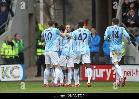 KINGSTON UPON HULL, ENGLAND -David Silva of Manchester City celebrates with his team mates after scoring their first goal during the Premier League match between Hull City and Manchester City at the KC Stadium, Kingston upon Hull on Saturday 15th March 2014 (Photo by Mark Fletcher/MI News/NurPhoto) Stock Photo