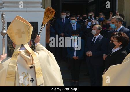 Archbishop of Krakow, Marek Jedraszewski, blesses a new commemorative plaque after a mass in next to the Basilica of the Presentation of the Blessed Virgin Mary, in Wadowice, the birthplace of Karol Wojtyla, later Pope John Paul II, on the eve of Pope's 100th birthday. On Sunday, May 17, 2020, in Wadowice, Lesser Poland Voivodeship, Poland. (Photo by Artur Widak/NurPhoto) Stock Photo