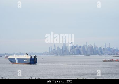 A view of a cargo ship in Staten Island with New York City skyline on the background during the coronavirus pandemic on May 19, 2020 in Borough of Staten Island in New York City. COVID-19 has spread to most countries around the world, claiming over 316,000 lives with over 4.8 million infections reported. Coronavirus has had a major impact on global shipping markets, with the slump in demand for goods from China having a ripple effect on everything from container ships to oil tankers. (Photo by John Nacion/NurPhoto)