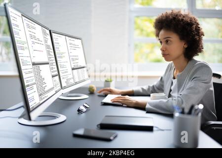 African American Woman Programmer. Girl Coding On Computer Stock Photo