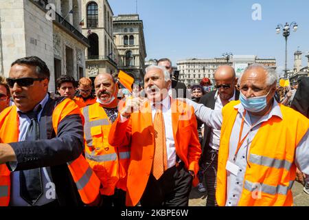 The leader Antonio Pappalardo arrives at the ''Gilet Arancioni'' protest in Piazza Duomo with orange vest during the Phase 2 of Coronavirus (COVID-19) National Lockdown on May 30, 2020 in Milan, Italy. During the demonstration, the social distances and the mask foreseen by the Covid-19 emergency were not respected. (Photo by Mairo Cinquetti/NurPhoto) Stock Photo