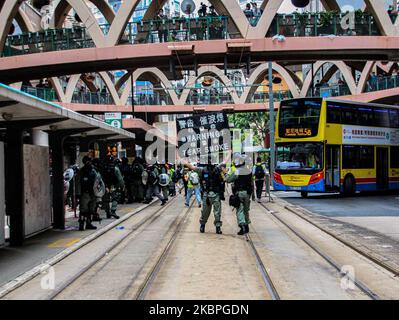 Police raise the black flag warning of teargas during street demonstrations in Causeway Bay, Hong Kong, 24th May, 2020. (Photo by Tommy Walker/NurPhoto) Stock Photo