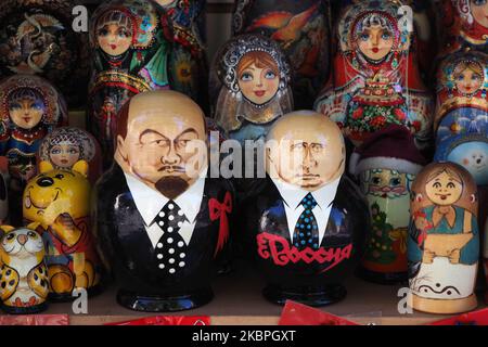 Painted Matryoshka dolls also known as Russian nesting dolls, bearing the faces of the founder of the Soviet Union Vladimir Lenin and Russian President Vladimir Putin on display in a souvenir shop in St. Petersburg, Russia, on May 31, 2020. (Photo by Sergey Nikolaev/NurPhoto) Stock Photo