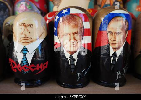 Painted Matryoshka dolls also known as Russian nesting dolls, bearing the faces of Russian President Vladimir Putin and USA President Donald Trump on display in a souvenir shop in St. Petersburg, Russia, on May 31, 2020. (Photo by Sergey Nikolaev/NurPhoto) Stock Photo