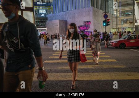 Shopping goers wear protective masks at the shopping district of Bukit Bintang in Kuala Lumpur city center Malaysia during Conditional Movement Control Order(CMCO) on May 31, 2020. From the early indications in April and May 2020, the economic environment is foreseen to be unfavorable for Malaysian businesses, according to the report. With the global lockdown, this unprecedented situation has caused a sharp contraction to the economy like never before. (Photo by Afif Abd Halim/NurPhoto) Stock Photo