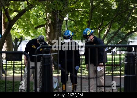 ATF (The Bureau of Alcohol, Tobacco, Firearms and Explosives) Agents are seen in front of storage structure in front of the White House was was burned, vandalized and tagged with graffiti after a night of protests following the death in Minneapolis police custody of George Floyd, in Washington, U.S., June 1, 2020. (Photo by Aurora Samperio/NurPhoto) Stock Photo