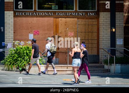 An REI store shop window shop remains boarded up after looting occurred amid protests on June 01, 2020 in Santa Monica, California. California Governor Gavin Newsom has deployed National Guard troops to Los Angeles County to curb looting and destruction of property amid the protests of the murder of George Floyd. Santa Monica, CA, USA.(Photo by John Fredricks/NurPhoto) Stock Photo