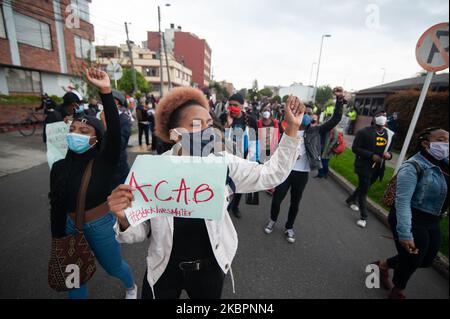 People take part in a demonstration in Bogota, Colombia, on June 3, 2020 in front of US Embassy to protest against the murder of George Floyd in the United States and for the Murder of Anderson Arboleda in Cauca, Colombia, both african americans killed by police. (Photo by Sebastian Barros/NurPhoto) Stock Photo