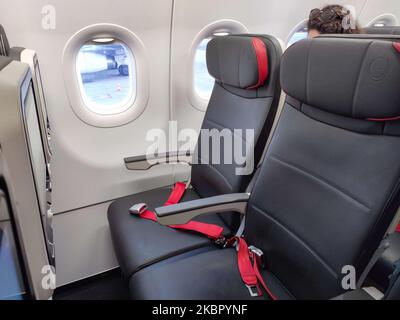 Economy Class seat of an Airbus A321 NEO. Flying with Turkish Airlines during the COVID-19 Coronavirus pandemic outbreak era. Fewer passengers are onboard in an almost empty airplane to fly, while passengers cabin crew and flight attendants are wearing protective face masks. The International flight TK 1843 from Istanbul New Airport in Turkey to the capital Athens in Greece is operated by a new modern, sophisticated and advanced aircraft, an Airbus A321neo with registration TC-LSN. (Photo by Nicolas Economou/NurPhoto) Stock Photo