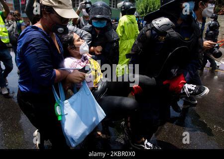 Nepalese Police detains a demonstrator during a protest near prime Minister’s residence demanding better testing for coronavirus disease (COVID-19) in Kathmandu, Nepal. 09 June 2020. (Photo by Rojan Shrestha/NurPhoto) Stock Photo