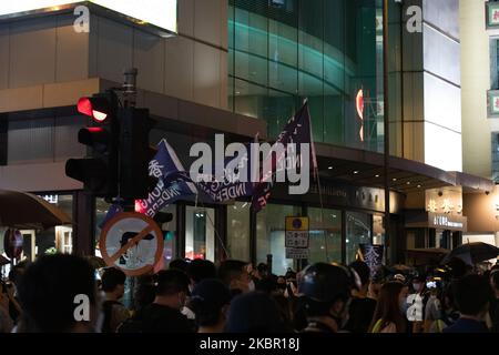 Hundres of protesters descent on Central Hong Kong in a Flash Mob march to commerate the 1 Year anniversary of the Anti Extradition Bill movement on 9th June 2020 in Hong Kong, China. 1 year ago 1 million people took to the streets in opposition of the Now withdraw Extradition bill. (Photo by Simon Jankowski/NurPhoto) Stock Photo