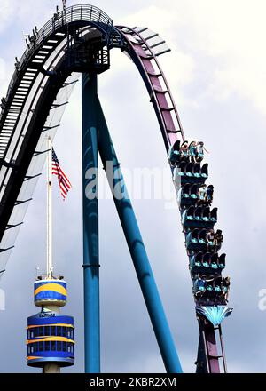 Visitors to SeaWorld Orlando are seen social distancing on one of the theme park's roller coasters as the attraction reopens after closing in March due to the coronavirus pandemic on June 11, 2020 in Orlando, Florida, USA. All guests are required to wear face masks and submit to temperature checks. (Photo by Paul Hennessy/NurPhoto) Stock Photo