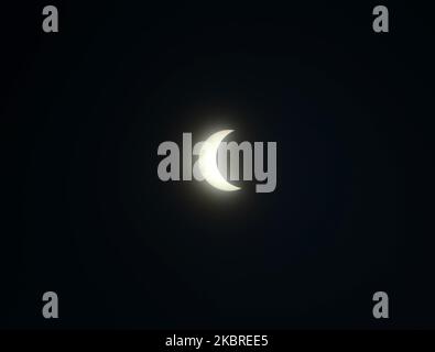 A partial solar eclipse is seen from Barasat , District of North 24 Parganas at outskirts of Kolkata, India on Sunday, 21st June , 2020. The eclipse will be visible from much of Asia, Africa, the Pacific, the Indian Ocean, parts of Europe and Australia. This is the first solar eclipse of 2020. (Photo by Sonali Pal Chaudhury/NurPhoto) Stock Photo