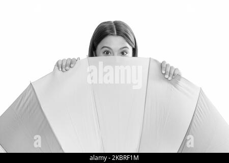 kid behind multicolored rain protection parasol isolated on white background, weather forecast. Stock Photo