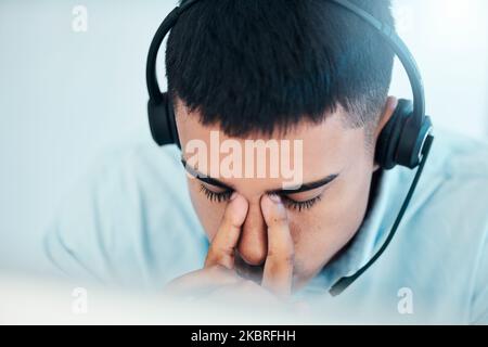 Stress, anxiety or headache for call center businessman in b2b customer support, crm consulting or Indian contact us office. Zoom, mistake or Stock Photo