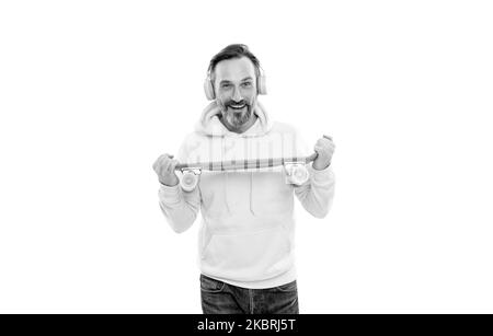 man in yellow hoody with skateboard. adult skateboarder. male casual hipster style. Stock Photo