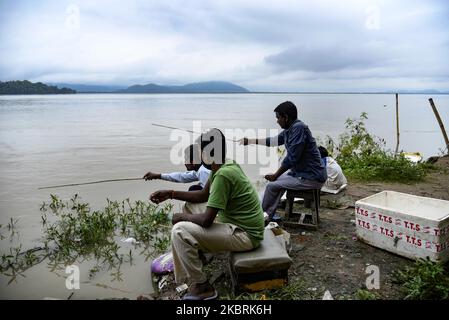 People fishing in the banks of Brahmaputra river, in Guwahati, Assam, India on Thursday, June 25, 2020. (Photo by David Talukdar/NurPhoto) Stock Photo