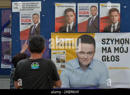 Election posters of Andrzej Duda and Szymon Holownia, seen in Krakow's Main Market Square. On Thursday, June 25, 2020, in Krakow, Lesser Poland Voivodeship, Poland. (Photo by Artur Widak/NurPhoto) Stock Photo