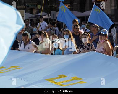 Crimean Tatars community in Ukraine attend a rally during the Crimean Tatars Flag Day celebration in Kyiv, Ukraine, on 26 June, 2020. (Photo by STR/NurPhoto) Stock Photo