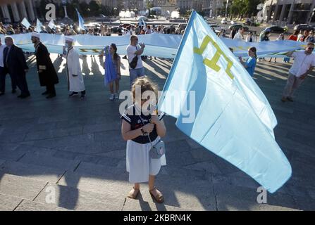 Crimean Tatars community in Ukraine attend a rally during the Crimean Tatars Flag Day celebration in Kyiv, Ukraine, on 26 June, 2020. (Photo by STR/NurPhoto) Stock Photo