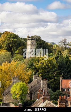 18th century Culloden Tower folly with parkland trees in autumn. Richmond, north Yorkshire, England, UK, Britain Stock Photo