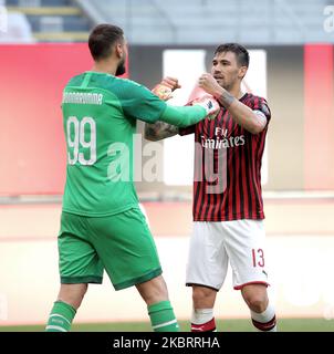 Alessio Romagnoli of AC Milan and Gianluigi Donnarumma of AC Milan celebrate a victory at the end of the Serie A match between AC Milan and AS Roma at Stadio Giuseppe Meazza on June 28, 2020 in Milan, Italy. (Photo by Giuseppe Cottini/NurPhoto) Stock Photo