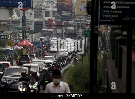 Vehicle seen with traffic jam at a street in Puncak, Bogor, West Java, Indonesia, June 28, 2020. after the Indonesian government lifted restrictions on movements, amid concerns the spread of coronavirus (COVID-19) disease. (Photo by Adriana Adie/NurPhoto) Stock Photo