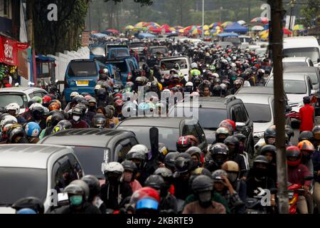Vehicle seen with traffic jam at a street in Puncak, Bogor, West Java, Indonesia, June 28, 2020. after the Indonesian government lifted restrictions on movements, amid concerns the spread of coronavirus (COVID-19) disease. (Photo by Adriana Adie/NurPhoto) Stock Photo