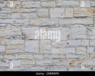 Pattern grey colour of modern design decorative uneven cracked real stone wall with cement Stock Photo