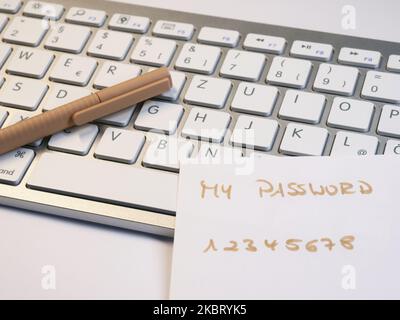 reminder with weak easy password on laptop keyboard Stock Photo