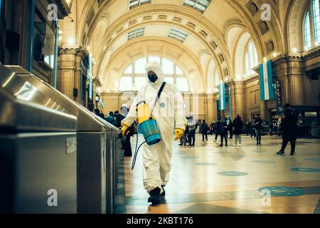 cleaning staff sanitizes common areas of the Constitution Central Train Station, Buenos Aires, Argentina, on July 1, 2020. The tightening of preventive and compulsory social isolation will rule at least until July 17 in the City of Buenos Aires and 35 municipalities of Greater Buenos Aires. (Photo by Federico Rotter/NurPhoto) Stock Photo