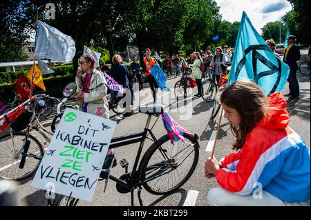 Extinction Rebellion activists are in front of the KLM headquarters with their bikes, during the Extinction Rebellion bicycle campaign against KLM support package, in Amsterdam, Netherlans on July 3, 2020. (Photo by Romy Arroyo Fernandez/NurPhoto) Stock Photo