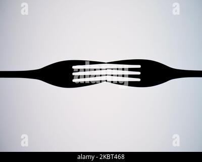 Outlines of two forks against a white background. copy space Stock Photo