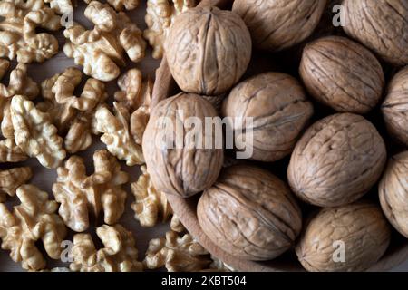 Shelled and peeled walnuts together, top view Stock Photo