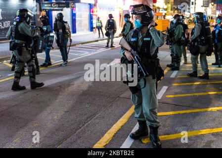 A policeman stands guard warily in Mongkok on 27 May 2020 in Hong Kong, China. (Photo by Marc Fernandes/NurPhoto) Stock Photo
