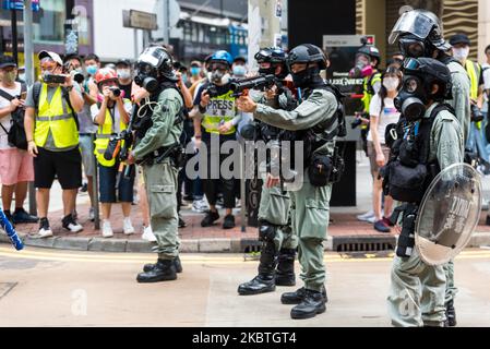 A policeman points a sponge ball gun in Hong Kong, China, 24 May 2020. (Photo by Marc Fernandes/NurPhoto) Stock Photo