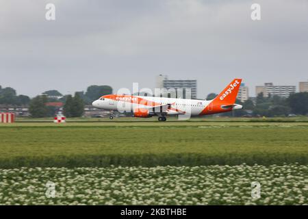 EasyJet Europe low cost airline Airbus A320 aircraft as seen on final approach on final flying, touch down, landing and breaking phase at Amsterdam Schiphol AMS EHAM International Airport in the Netherlands on July 2, 2020. The British budget carrier with headquarters in London, U2 Easy Jet is flying an all airbus fleet. The specific narrow body airplane has the registration OE-INP and 2x CFMI engines and is the branch part of EasyJet Europe Airline BmbH fleet EC EJU ALPINE based in Vienna. (Photo by Nicolas Economou/NurPhoto) Stock Photo