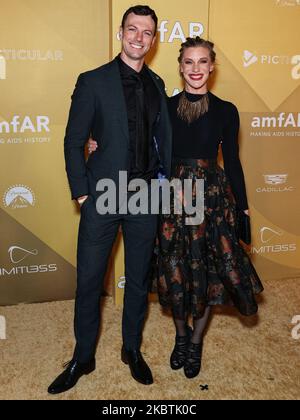 Robin Gadsby and Katee Sackhoff arrive at the amfAR Gala Los Angeles at
