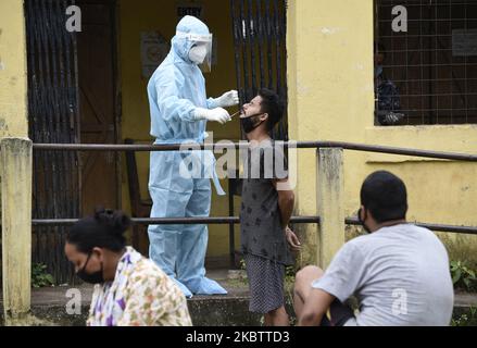 Health worker collecting swab sample for COVID-19 test, at a screening centre, Guwahati, Assam, India on 18 July 2020. (Photo by David Talukdar/NurPhoto) Stock Photo