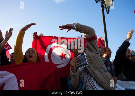 Tunisian protesters shoot slogans during an anti government demonstration at the Kasba in Tunis, Tunisia on November 15, 2013. Around 250 people took part in the protest shouting slogans like ''move along'' (written on the posters as well) and asking the resignation of the ruling Islamist party Ennahda. (Photo by Emeric Fohlen/NurPhoto) Stock Photo