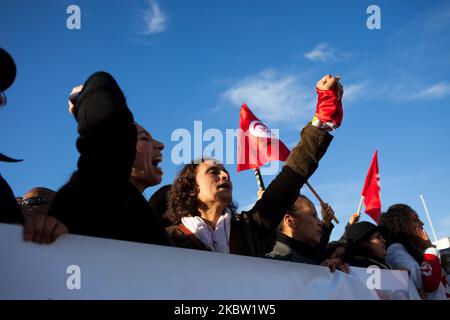 Tunisian protesters shoot slogans during an anti government demonstration at the Kasba in Tunis, Tunisia on November 15, 2013. Around 250 people took part in the protest shouting slogans like ''move along'' (written on the posters as well) and asking the resignation of the ruling Islamist party Ennahda. (Photo by Emeric Fohlen/NurPhoto) Stock Photo